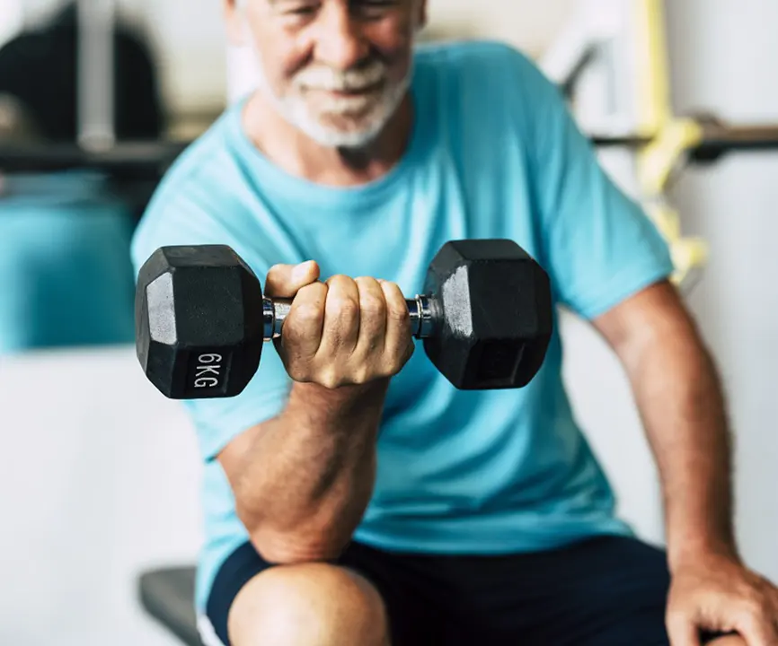 older man doing bicep curls